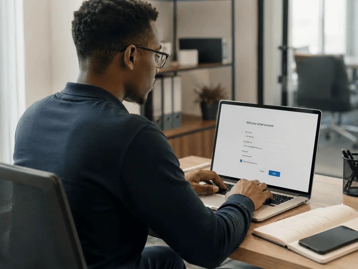 Analyst monitoring systems on a laptop